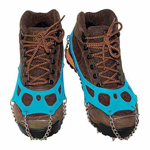 Yatta Life ice spikes in blue on two brown hiking boots, front view