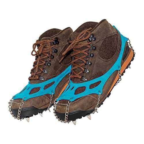 Yatta Life ice spikes on two brown hiking boots, angled view showing blue harness and spikes